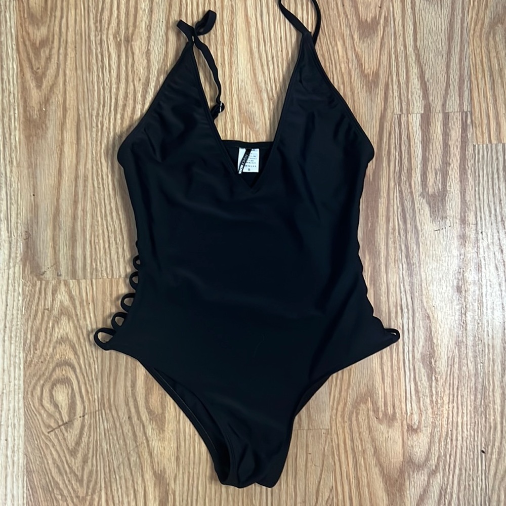 Low cut black one piece bathing suit